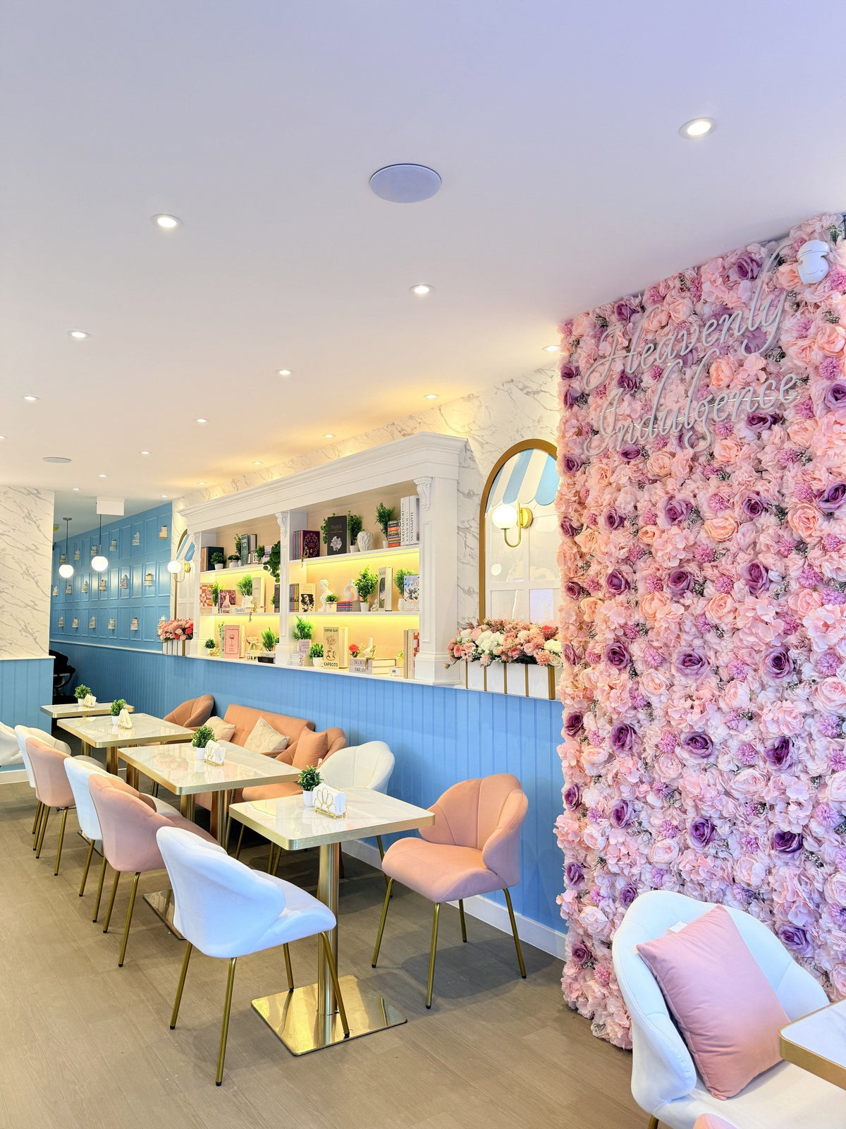 7th Heaven café seating and flower wall
